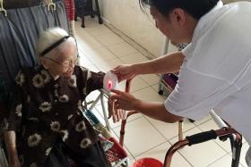 SPECIAL DELIVERY:Madam Wong was one of the residents at Chin Swee Road who got a new doorbell.
