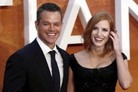 Actors Matt Damon (L) and Jessica Chastain arrive for the UK premiere of The Martian at Leicester Square in London, Britain