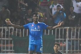 AWAY BLUES: Madhu Mohana and goalkeeper Izwan Mahbud (right) showing the LionsXII’s frustration after conceding against Kedah.