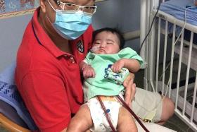 SHARING: Mr Jeremy Chew hopes to raise awareness of infant organ donation by talking about his son Aiden&#039;s condition.