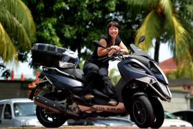 A member of Sheriders Chapter, the petite Ms Cheryl Chan loves the feeling of being on her Gilera Fuoco 500.