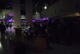 IN THE DARK: Hougang MRT station during the blackout..