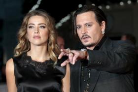 Johnny Depp and his actress wife Amber Heard at the British premiere of the film &quot;Black Mass&quot; in London.