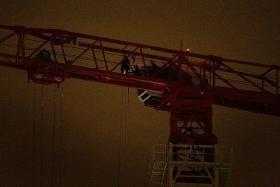 HELP: The tower crane operator had to be rescued by Dart officers.