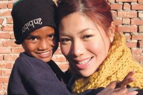AT RISK: Belinda Lee with one of India&#039;s vulnerable street children, many of whom were abandoned.