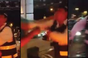 An LTA Enforcement officer seen in a  scuffle with a driver at Bugis Junction