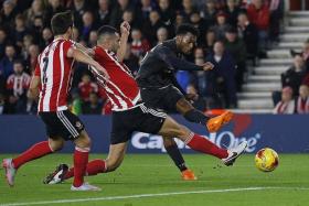 SUPER STATS: Daniel Sturridge (above, in black) has now scored 44 times in 73 appearances for the Reds,  39 of them from 59 starts, and has six goals in his last five League Cup games.