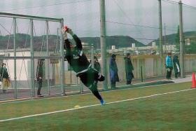 BIG IN JAPAN: Izwan Mahmud showing his agility in saving a smaller ball used in training at J2 League side Matsumoto Yamaga (above). He is also a big hit with the fans at the club (inset).