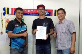 DONE DEAL: Malaysian club PDRM FA posted on their social media platforms a photo of national footballer Safuwan Baharudin holding what appears to be a contract.