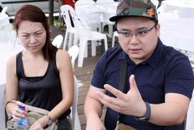 GRIEVING: Madam Claire Ng (left) and her husband Darius Liew at the Lims' wake in Sin Ming Drive yesterday. Madam Ng's sister, brother-in-law and nephew died in the crash.