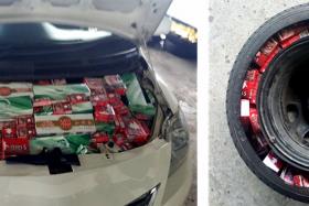 Contraband cigarettes found in the bonnet and spare tyre.