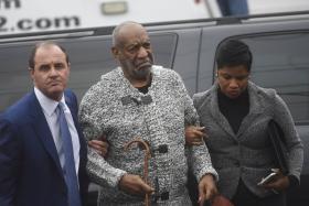 Actor and comedian Bill Cosby arrives with attorney Monique Pressley (right) for his arraignment on sexual assault charges at the Montgomery County Courthouse in Pennsylvania.