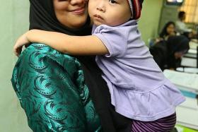 SAFE: Angie Tiong with a social worker in Johor Baru.