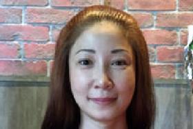 ACCUSED: Guan Enmei, an ex-wife of alleged match fixer Dan Tan Seet Eng, disputed the charge of giving false information.