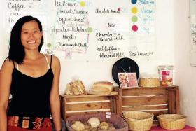 A TASTE FOR HELPING OTHERS: Miss Denise Lim in her bakery (left) and restaurant (above).
