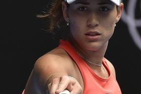 EYEING THE TITLE:  Garbine Muguruza (above) advances to the third round and has been tipped as a future world No. 1.