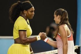 WORDS OF ENCOURAGEMENT: Serena Williams consoles a stunned Daria Kasatkina, saying that the young Russian has a bright future ahead of her.