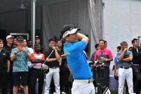 IN THE SWING OF THINGS: YE Yang (above) demonstrating what the TaylorMade golf clubs can do at the Sentosa Golf Club driving range yesterday.