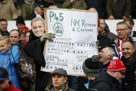 NO GUARANTEE: The fans make their feelings known, but United&#039;s problems may not end even if their wishes come true.