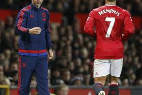 MY MENTOR: Memphis Depay (above) says Manchester United assistant manager Ryan Giggs (left) is helping him get to grips with the Premier League.