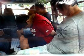SUSPECTS: Benjamin Ling Jialiang, Fong Ling Ling (above, in red) and Judy Wee Aye Fong (right).