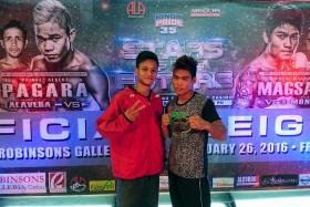 POWER PACKED: Singapore boxer Ridhwan Ahmad (left) will be facing Melchor Roda (right), who has won all his three professional bouts by knockout. 