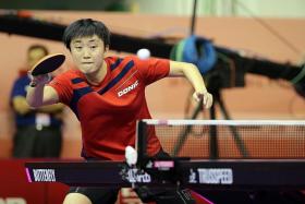 SINGAPORE WOMEN PADDLERS: Feng Tianwei (above) and Yu Mengyu during a training session.