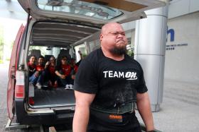 POWER: Mr Ahmad Taufiq Muhammad lifted a van five times as ONE FM’s #1 Breakfast Show crew members Elliott Danker, The Flying Dutchman, Shaun Tupaz, Andre Hoeden and Glenn Ong got into it one after the other.