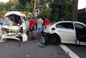 CRUSHED:  (Above)The accident on Ayer Rajah Expressway involved a car, a van and a private bus.