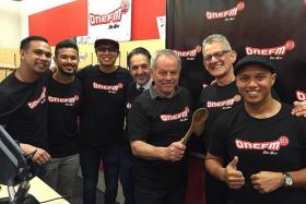 BONDING: Celebrity chef Wolfgang Puck (holding the spoon) with his business partner Alex Reznik and the ONE FM’s #1 Breakfast Show team.
