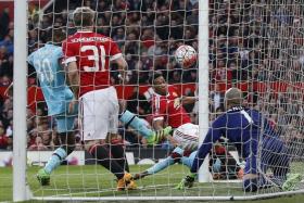STAYING ALIVE: Anthony Martial (second from right) cancelling out Dimitri Payet&#039;s superb free-kick.  