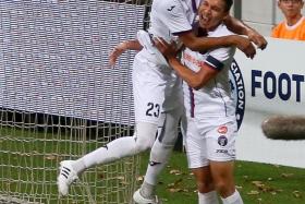 ON THE GOAL TRAIL: Warriors FC striker Jonathan Behe (above, left) celebrates his goal against Balestier Khalsa with Shaiful Esah.