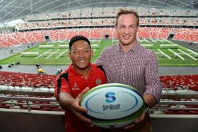 READY TO RUMBLE: President&#039;s XV captain Gaspar Tan (left) and World First Premiership Select captain Matthew Humphreys get a feel of the National Stadium ahead of their clash.