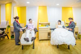 UNITED: Mr Ong Chin Hock and Miss Yeo Zhi Wei, who donated blood at Bloodbank@Dhoby Ghaut on their first date, had their wedding shoot at the blood donation centre last week.