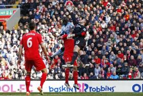 CRUCIAL: A mistake by Liverpool goalkeeper Simon Mignolet allowed Newcastle&#039;s Papiss Cisse (centre) to score their first goal which sparked their revival.