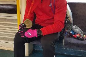 211TH OVERALL: Soh Rui Yong posing with his London Marathon finisher&#039;s medal yesterday.