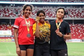 SILVER SHINE: (From left) Singapore&#039;s Shanti Pereira with the 100m winner, Malaysia&#039;s Komalam Shally Selvaratnam, and bronze-medallist Siti Fatimah.
