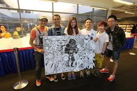 MAY THE 4TH BE WITH YOU: Mr Mas Shafreen (far left) of Band of Doodlers at last year&#039;s Star Wars Day.