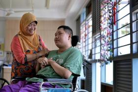 CARE: Madam Jamilah Othman&#039;s son Mr Khairul Abdul Majid is in a nursing home after getting into an accident 12 years ago.