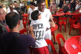 TOUGH FIGHT: (Above) Mr Murali Pillai meeting supporters after winning the Bukit Batok by-election yesterday.