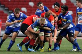 NO WAY THROUGH: Stormers lock Pieter- Steph Du Toit (with the ball) trying to find a breakthrough as the Sunwolves stand firm in defence. 