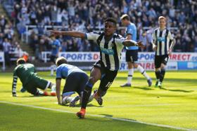 Rolando Aarons celebrates scoring the fourth goal for Newcastle United 