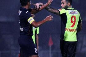 AGITATED: Jermaine Pennant (right) confronting Warriors captain Zulfadli Zainal (left) after a heavy tackle.