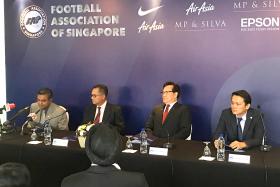 MAN IN CHARGE: (Left to right) Sundramoorthy, Football Association of Singapore (FAS) president Zainudin Nordin, FAS vice-president Lim Kia Tong, FAS secretary general Winston Lee
