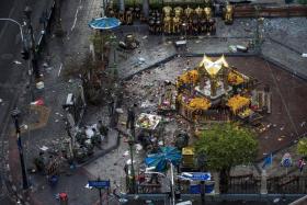 SCENE: The Erawan Shrine a day after the bombing on Aug 17 last year.