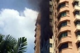 BURNING: A fire broke out in a 10th-storey unit at Simsville condo yesterday.