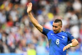 France&#039;s forward Dimitri Payet celebrates after scoring the 2-1 during the Euro 2016 group A football match between France and Romania at Stade de France.