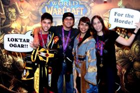 TEAMWORK: (From left) Jason, Mr Austin Lay, Trisha and Mrs Tanja Lay at the World Of Warcraft 10th anniversary event at Zouk in December 2014. 