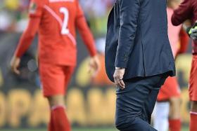 DOWN AND OUT: Brazil coach Dunga (left) has been sacked, no thanks to the disputed goal by Peru&#039;s Raul Ruidiaz (above, centre).