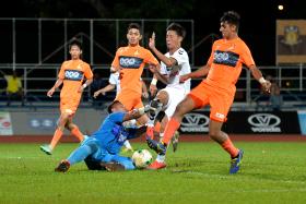 RUN ENDS: Albirex Niigata (in white) broke Hougang’s (in orange) six-game unbeaten streak at home last night. 